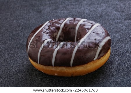 Glazed sweet tasty chocolate icing donut