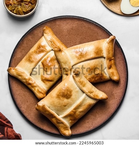 Tasty Chilean meat empanadas, typical food of the Chilean national holiday
Homemade baked pinewood empanadas Royalty-Free Stock Photo #2245965003