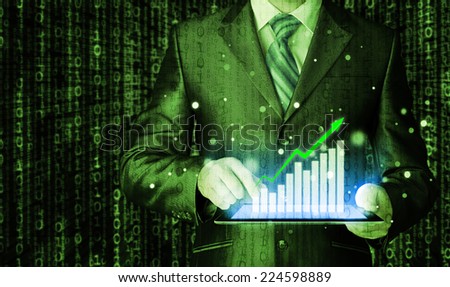 business man using tablet computer to work with financial data