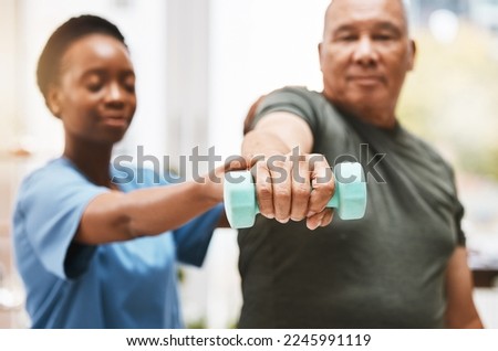 Medical, training and physiotherapy with dumbbell and old man with nurse for rehabilitation, support and retirement. Healthcare, help and physical therapy with patient and black woman in nursing home Royalty-Free Stock Photo #2245991119