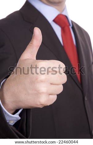 Business man in dark suit and red tie giving ok gestures isolated