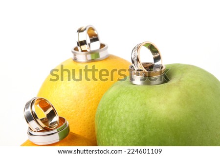 wedding rings for wedding and fresh citrus fruits groom and bride joy of great happiness celebration jewelry gold white silver diamonds girl happy green yellow orange