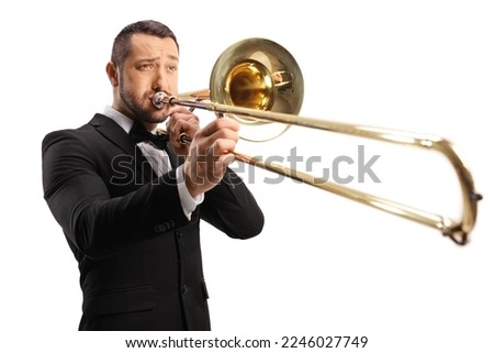 Young man playing a trombone isolated on white background Royalty-Free Stock Photo #2246027749