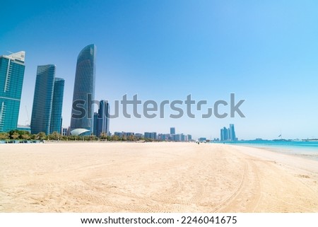 Corniche Beach and cityscape in Abu Dhabi, UAE.
Corniche Beach and promenade with cityscape skyline of Abu Dhabi, UAE on a sunny day. Royalty-Free Stock Photo #2246041675