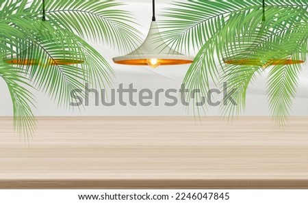 An image of a yellow lamp.blank wooden perspective coconut leaves on white cloth background.