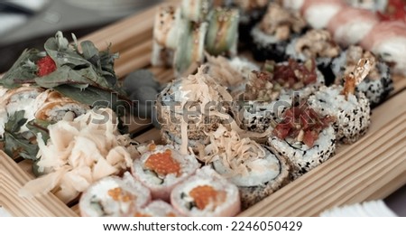 Sushi set on a wooden serving close-up