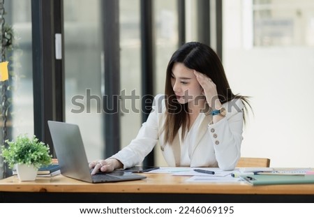 Asian businesswoman working with documents and stressed over worked from work in the office, Overworked woman concept. Royalty-Free Stock Photo #2246069195