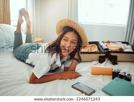 Happy, travel packing and woman on a hotel bed with suitcase ready for summer vacation. Luggage, bedroom and smile of a person relax in accommodation with clothes or happiness about traveling journey