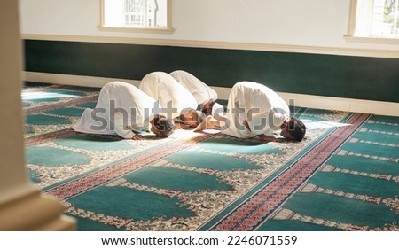 Muslim, prayer and mosque with a holy man group praying together for fajr, dhuhr or asr, otherwise maghrib or ishaa. Salah, worship and pray with islamic friends at ramadan for religion in sun rays Royalty-Free Stock Photo #2246071559