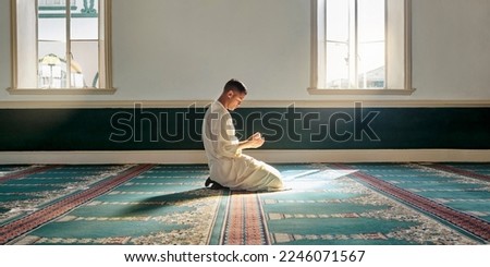 Muslim pray, hope or hands in prayer on carpet for peace, gratitude or support to Allah in holy temple or mosque. Trust, Islamic or spiritual person praying to worship God on Ramadan Kareem in Qatar Royalty-Free Stock Photo #2246071567