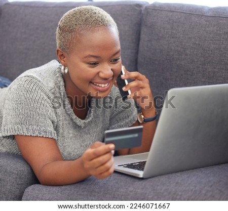 Phone call, credit card and black woman on laptop for bank communication online with satisfied smile. Finance loan application approval and phone update for happy girl at home in South Africa.