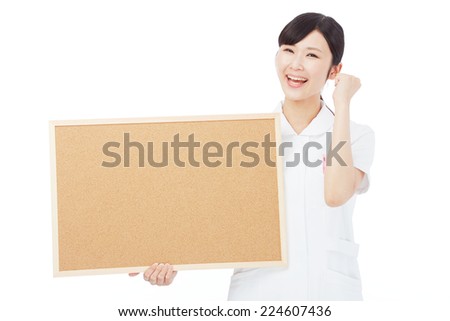 smiling Japanese nurse with Bulletin Board