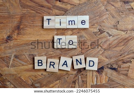 Time to brand text on wooden square, business inspiration quotes