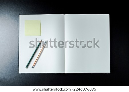 Open blank notebook with stationery accessories. Top view. Notepad. smile. Blank notebook concept. Smile concept.