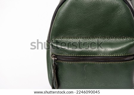 dark green leather backpack on a white background, details, product photography