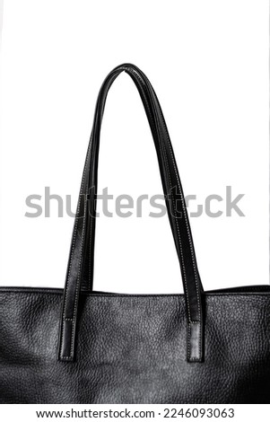 large and roomy basic black leather bag on a white background, without unnecessary details, concept, product photography