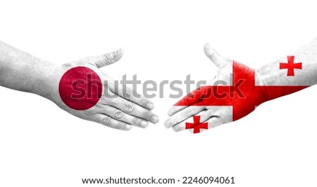 Handshake between Georgia and Japan flags painted on hands, isolated transparent image.