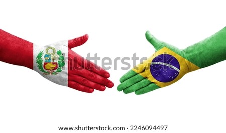 Handshake between Brazil and Peru flags painted on hands, isolated transparent image.