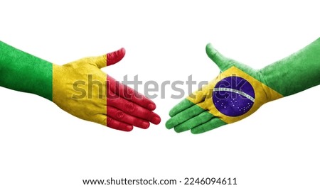 Handshake between Mali and Brazil flags painted on hands, isolated transparent image.