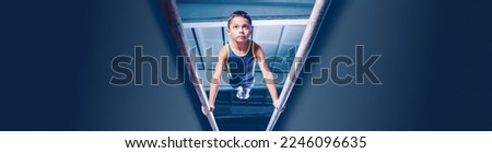 Image of little boy, child training, doing gymnastics exercises on parallel bars at gym. Developing strength and endurance. Concept of sportive lifestyle, childhood, health. Banner, flyer