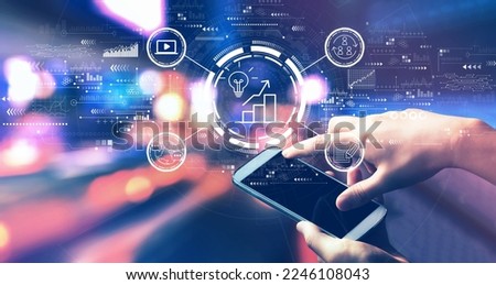 Content marketing concept with person using a smartphone in a city at night