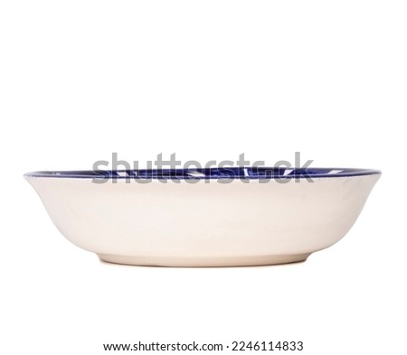 Deep blue ceramic plate made in Mexico. Traditional handmade Mexican ceramic. isolated White background. Royalty-Free Stock Photo #2246114833