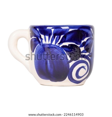 Round blue ceramic mug made in Mexico. Traditional handmade Mexican ceramic. isolated White background.
