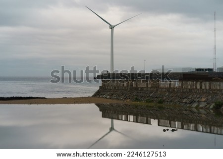 Beautiful landscape. Gran Canaria island. Wind turbines as alternative eco-friendly energy source near the Atlantic ocean. Concept of the beauty in nature. The theme of caring for the environment.