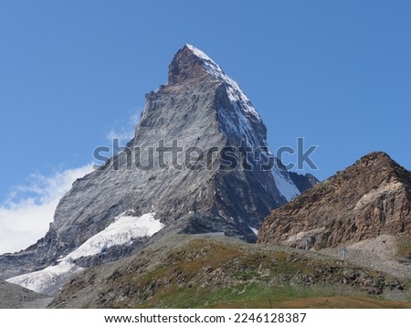 Matterhorn, Cervino mount, 4 478 m in european Alps at canton Valais in Switzerland, clear blue sky in 2018 warm sunny summer day on August. Royalty-Free Stock Photo #2246128387