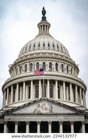 Facade of the United States Capitol building in Washington, D.C. on a cloudy and moody day.  Royalty-Free Stock Photo #2246132977