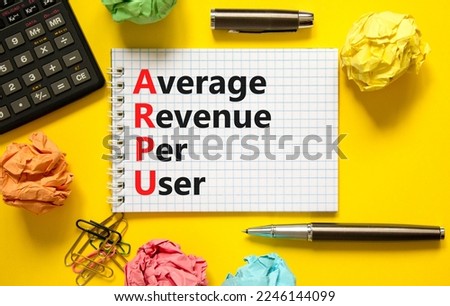 ARPU average revenue per user symbol. Concept words ARPU average revenue per user on white note on beautiful yellow background. Business ARPU average revenue per user concept. Copy space.