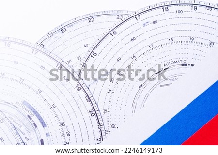 Tachograph. Driver time tracking. Fixing the movement of the car. Cargo transportation with driving according to the schedule. Time disk. Background from recorded analog tachograph disks.