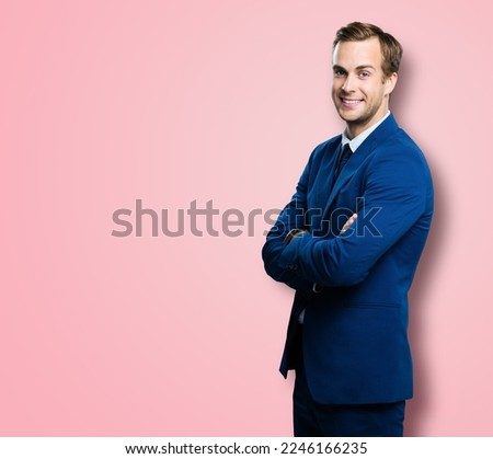 Portrait of smiling businessman in suit and tie, with crossed arms, isolated over rose pink colour background. Business man at studio picture. Copy space for some text. Layer, real estate sale agent.