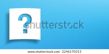Note paper with question mark on panoramic blue background