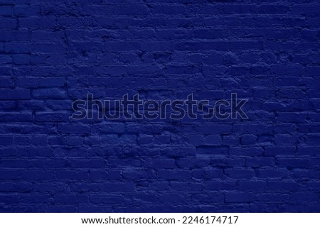 Closeup of grunge brick wall painted dark blue