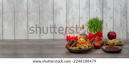 Festive table in honor of Navruz. Wheat with a red ribbon, the traditional holiday of the vernal equinox Nowruz. banner