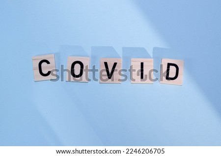 The word Covid on wooden cubes. Medical concept.