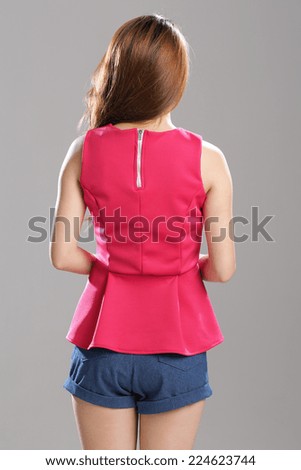 Asian Fashion Model in Leatherette Red Drop-Waist Crepe Top with light blue denim shorts.