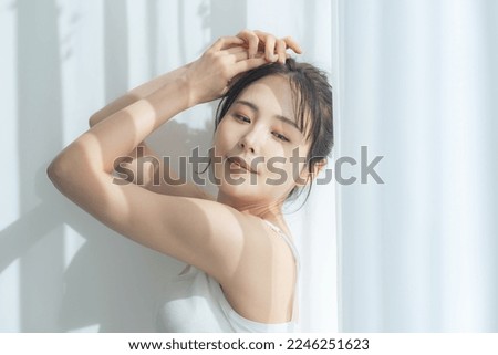 Beauty concept of an Asian woman in natural color tone. skin care. Royalty-Free Stock Photo #2246251623