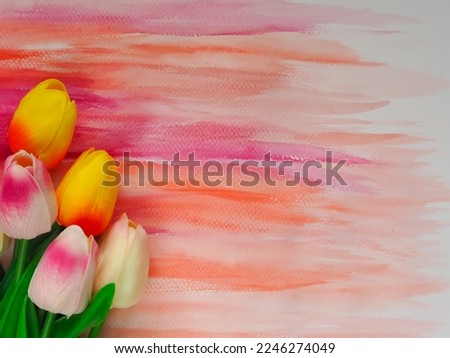 Fake tulips on watercolor painted paper for copy space background.