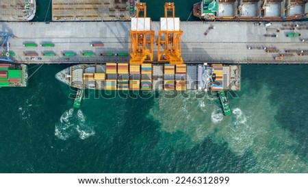 Crane loading cargo box to Large container Ship at Cargo Sea Port. Freight shipping container box transportation and logistics to Customs sea port.