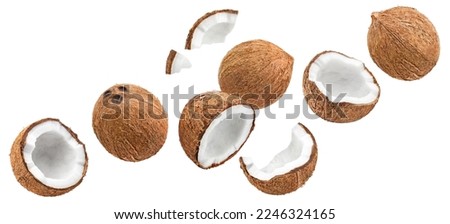 Flying delicious coconuts, isolated on white background Royalty-Free Stock Photo #2246324165