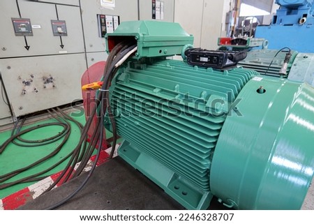 Testing the induction motor by running No load Test and measuring the current, voltage and vibration of the motor and recording the values on the check sheet. Industrial and technology works concept Royalty-Free Stock Photo #2246328707