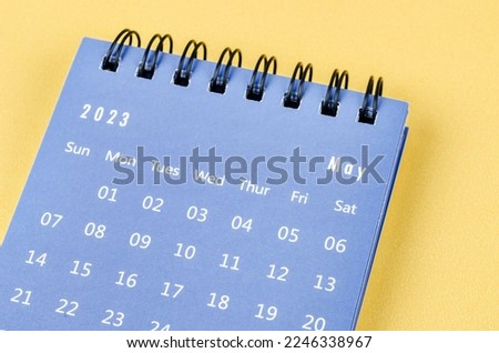 May 2023 Monthly desk calendar for 2023 year on yellow background. Royalty-Free Stock Photo #2246338967