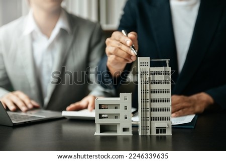  Signing a contract. Client and broker agent, lease agreement, successful deal and  Young business sitting at the desk in office 
 Royalty-Free Stock Photo #2246339635