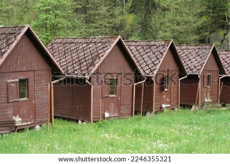 Old wooden huts in forest camp, camping in the wild concept
