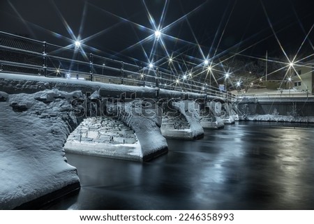 Old stone bridge in winter time