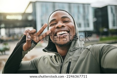 Fitness, selfie and man with peace sign in the city while doing a cardio exercise in Nigeria. Happy, smile and Nigerian guy taking picture while running for sports, race or marathon training in town.