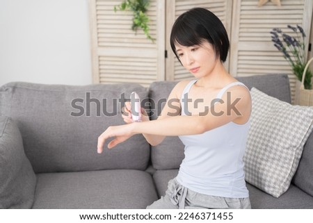 Beauty image of a young woman who self hair removes her arms