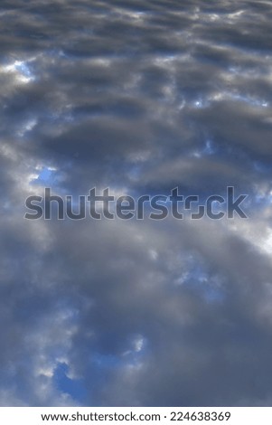 close-up of isolated beautiful bright clouds at sunset on a background of blue sky